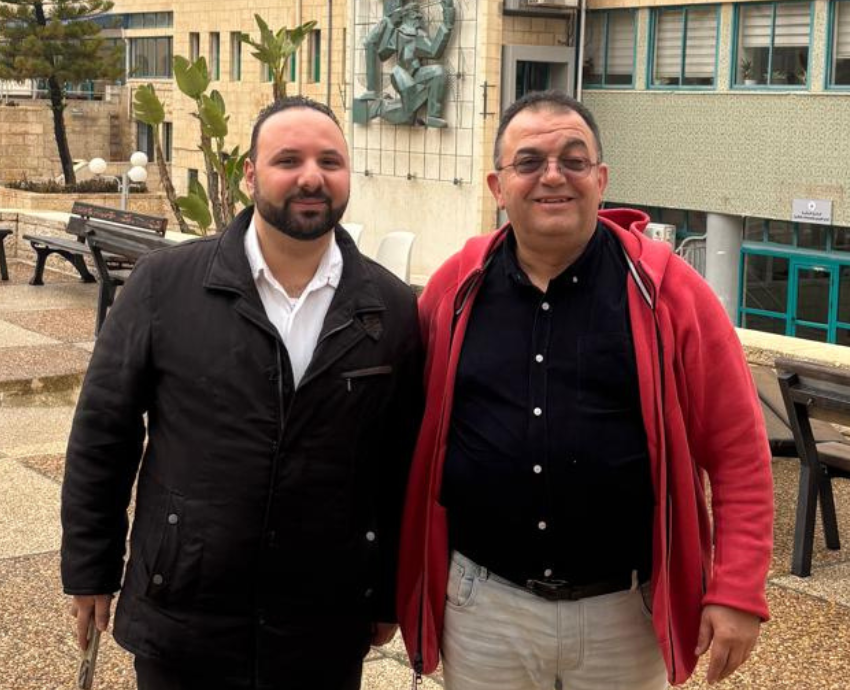 Two men standing together