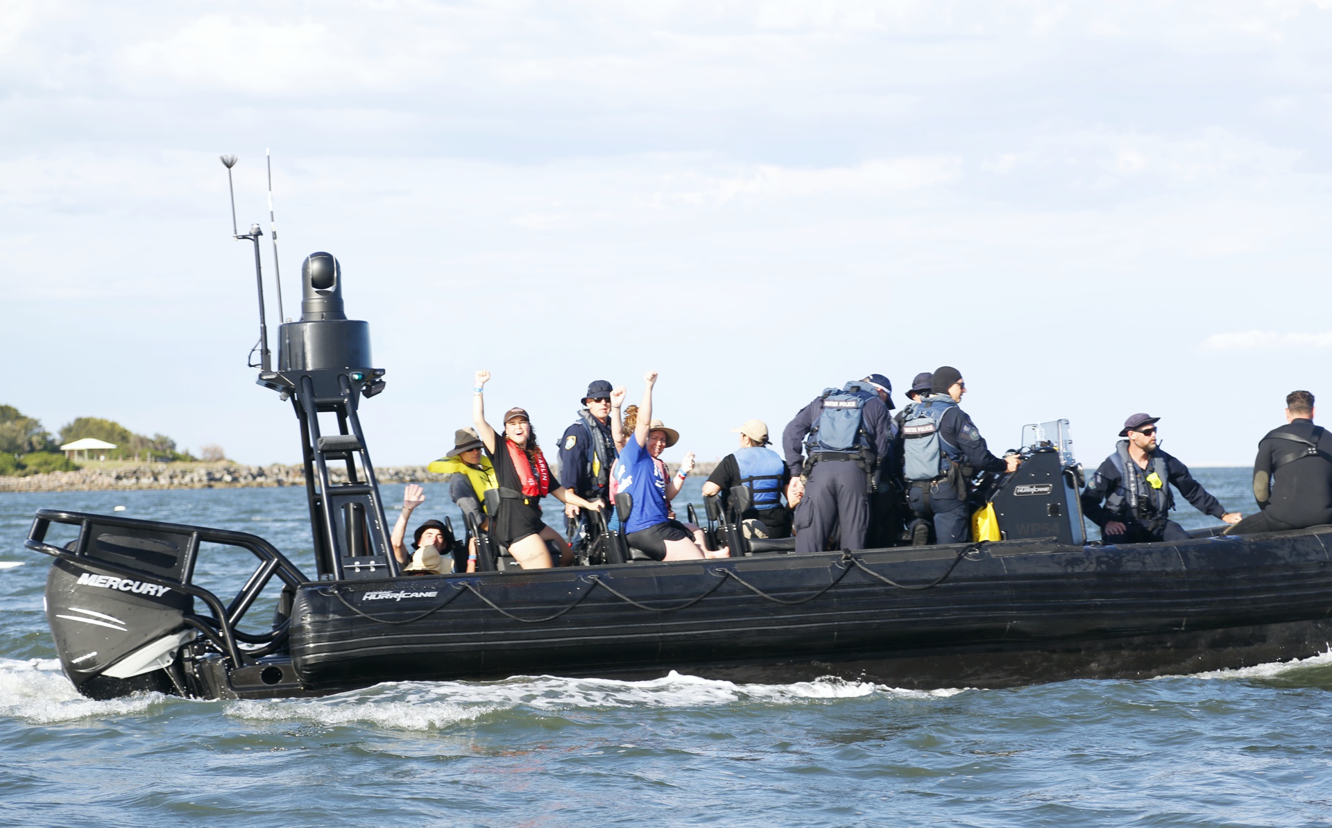 Arrestees defiant on police boat