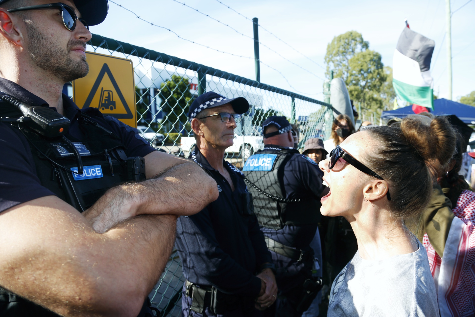 Confronting police outside Ferra Engineering