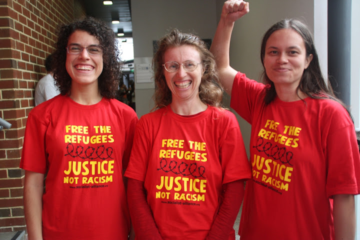 Protesters with matching Free the refugees t-shirts