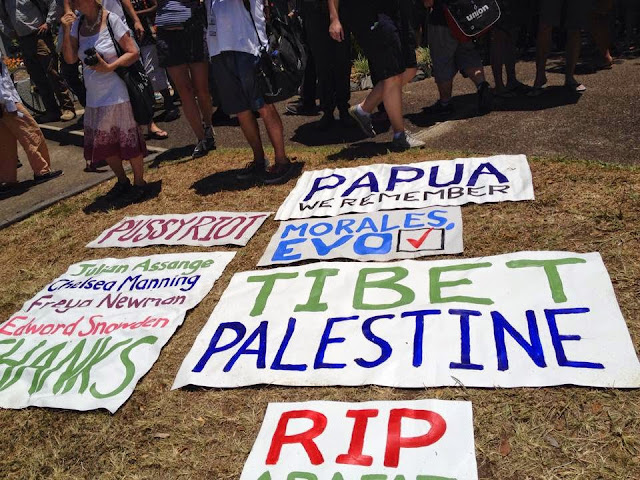 International solidarity banners at G20 economic forum protests Brisbane 2014.