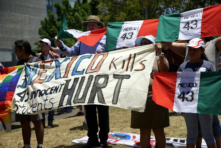 International solidarity banners at G20 economic forum protests Brisbane 2014.