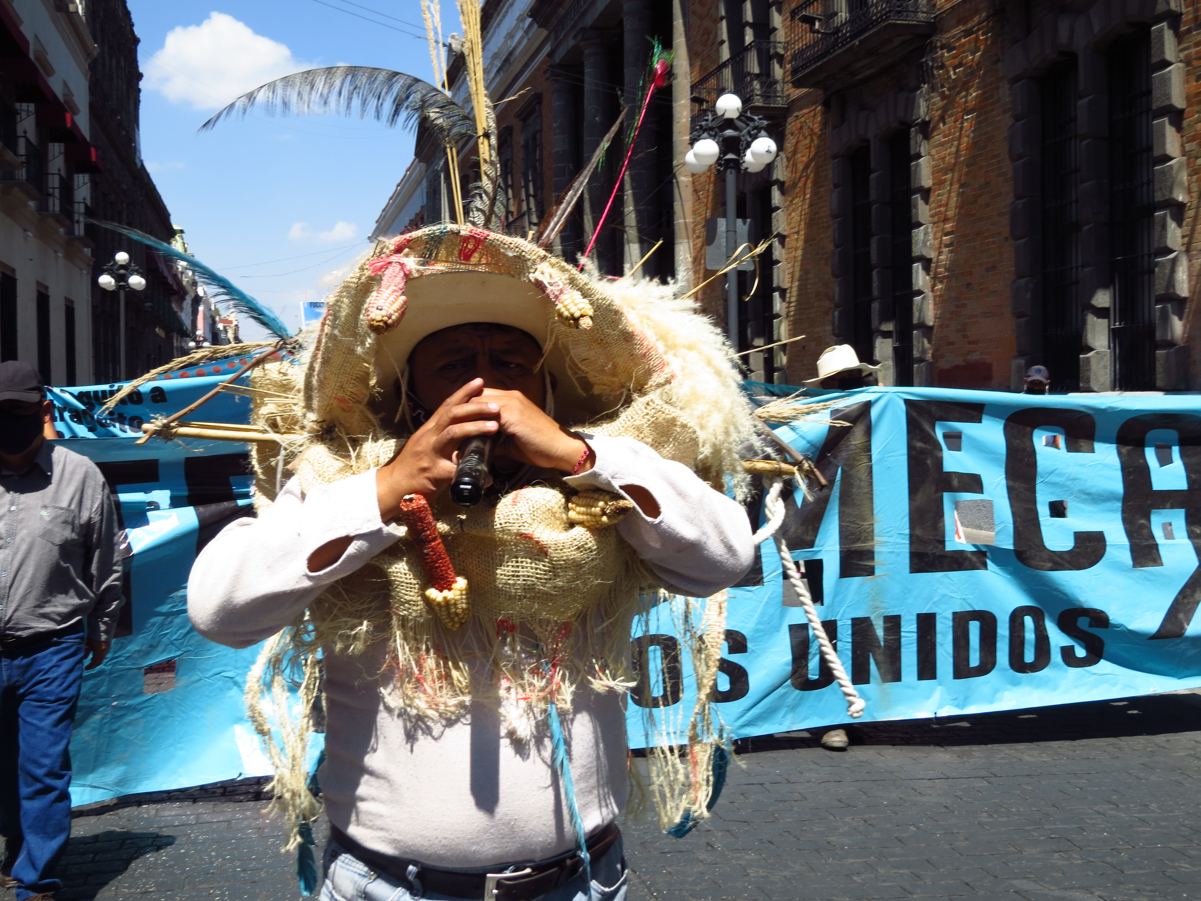 The convoy marches through Puebla city to protest outside the state parliament