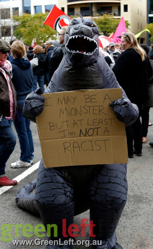 Protest in a monster costume with sign