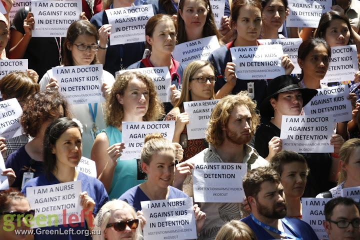 Protesters holding signs