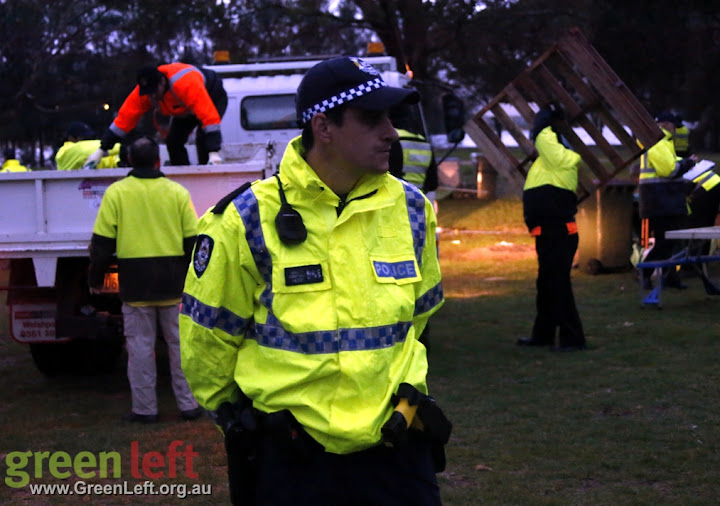 Police guard council workers during Matagarup Aboriginal encampment raid June 18, 2015.
