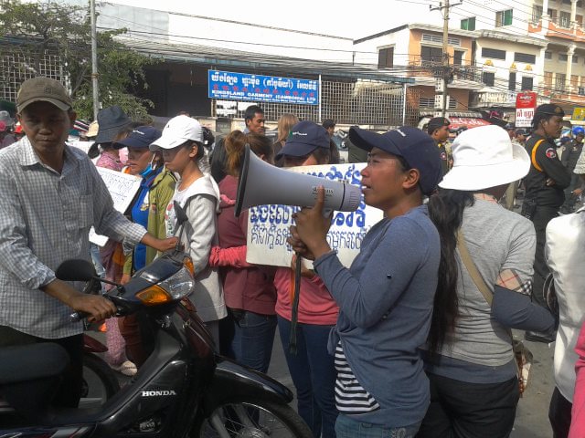 Protesting garment workers occupying street outside the factory in Phnom Penh that owes then unpaid wages.