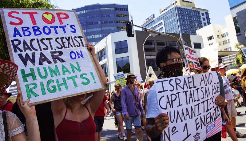 Stop Abott's sexist racist war placard at G20 economic forum protests, Brisbane 2014.