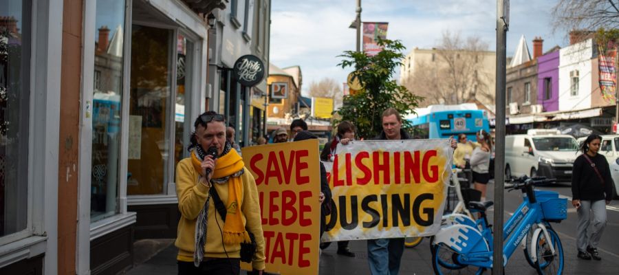 Rachel Evans and Isaac Nellist campaigning against public housing demolitions in Glebe