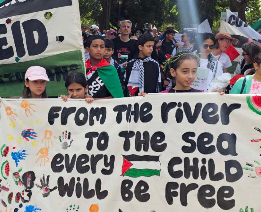 kids holding a banner