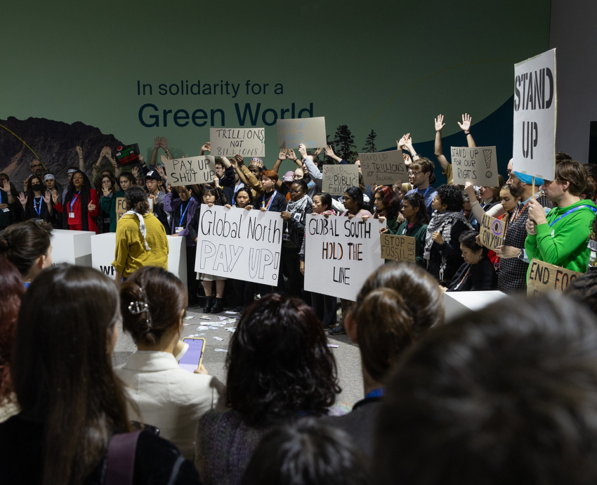 Protesters with banner and signs