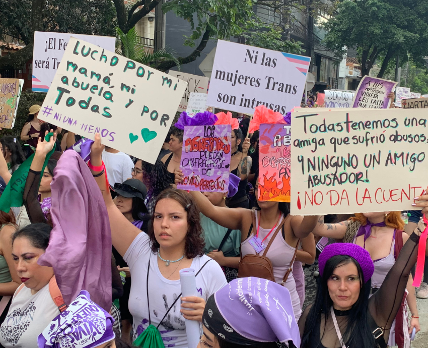 women marching with signs