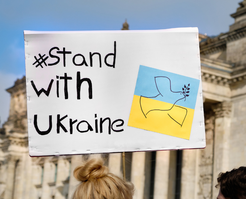 Placard reads "Stand with Ukraine"
