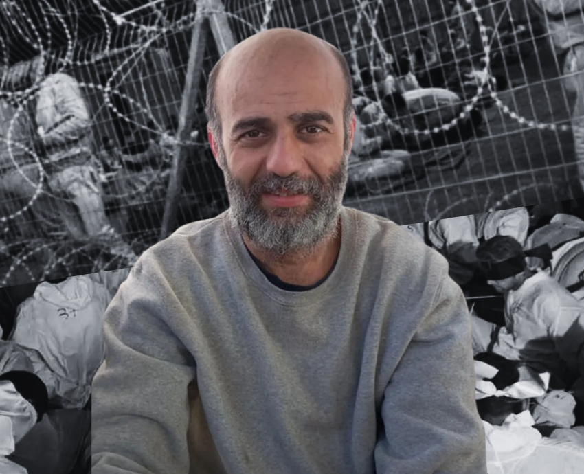 Seated man against a backdrop of photos of Israeli detention centres