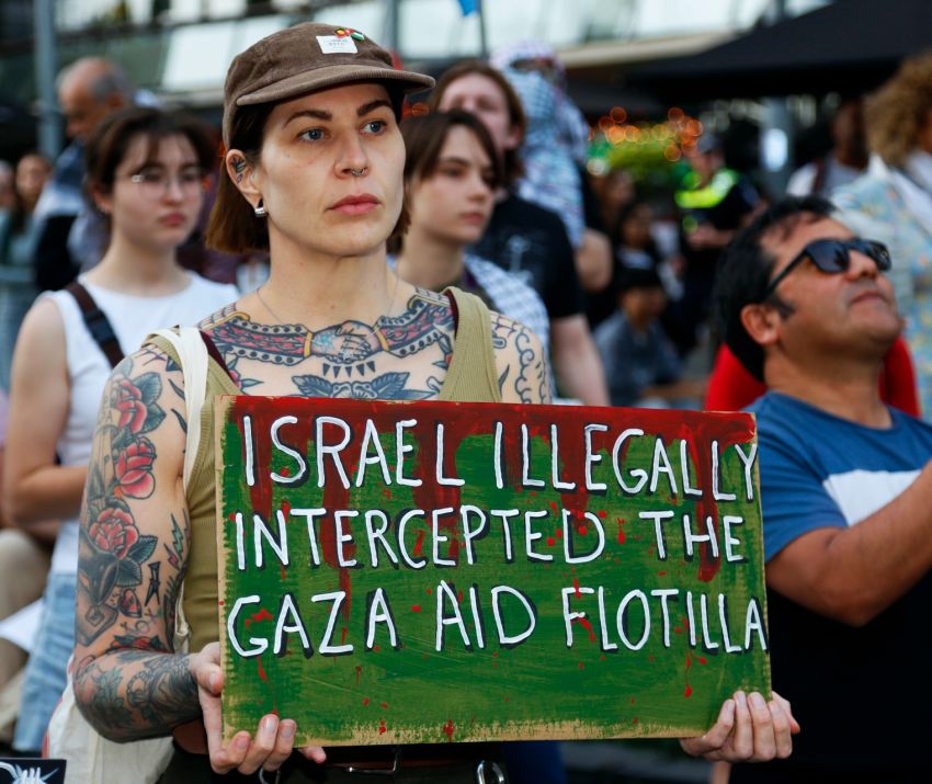 A sign reading: Israel illegally intercepted the Gaza aid flotilla
