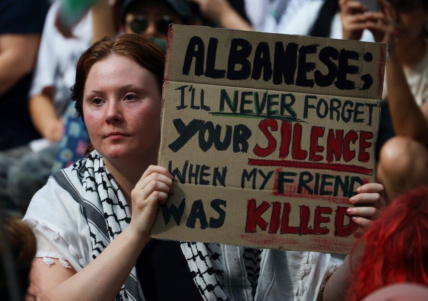 Woman holding a sign