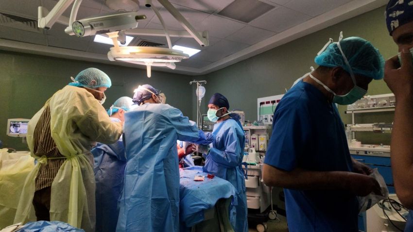 Surgeons and medical staff perform an operation in Gaza