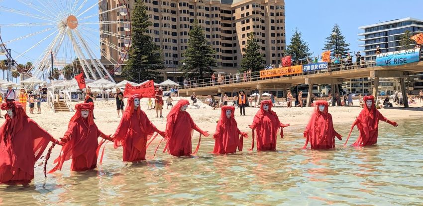 Photo of Red Rebels Brigade at Seas Are Rising protest at Glenelg Beach