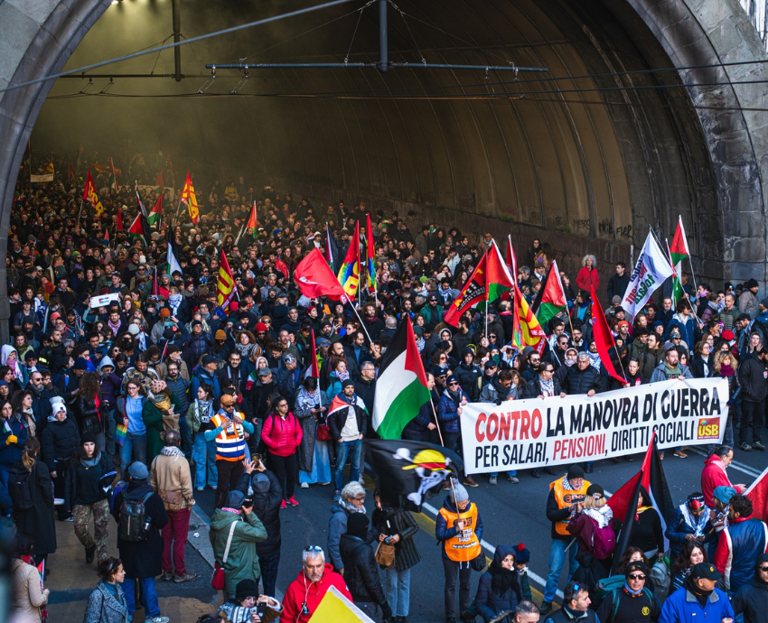 Protesters with banners against war and militarism in Italy
