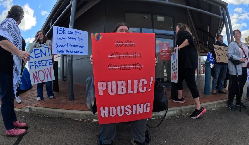 Cropped photo of housing portestors outside Nick Champion's electoral office.