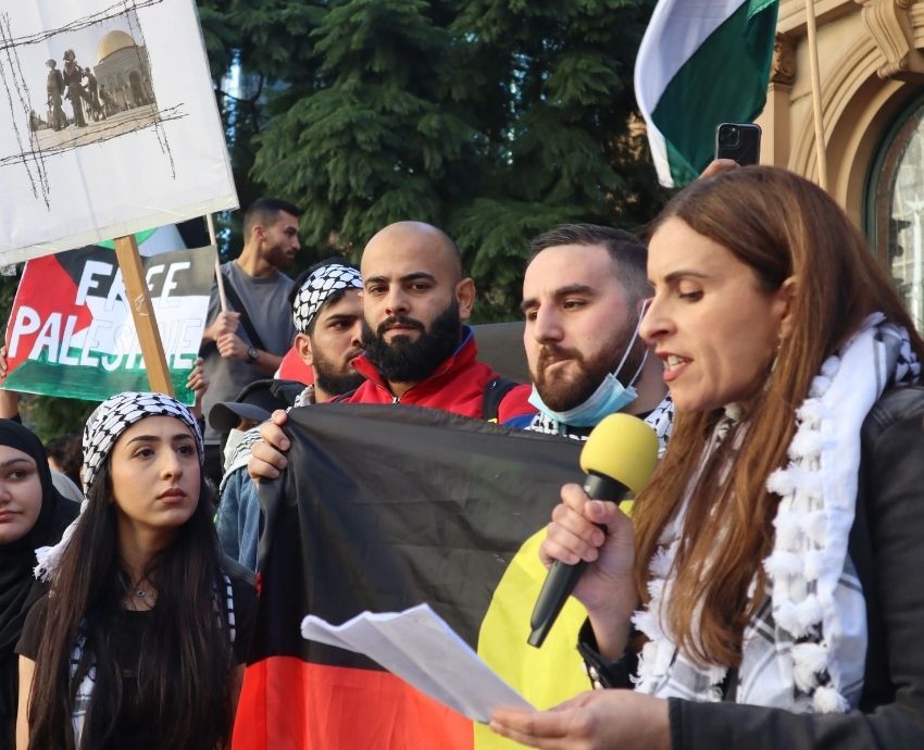 Dr Randa Abdel-Fattah addressing a Palestine solidarity rally on Gadigal Country/Sydney