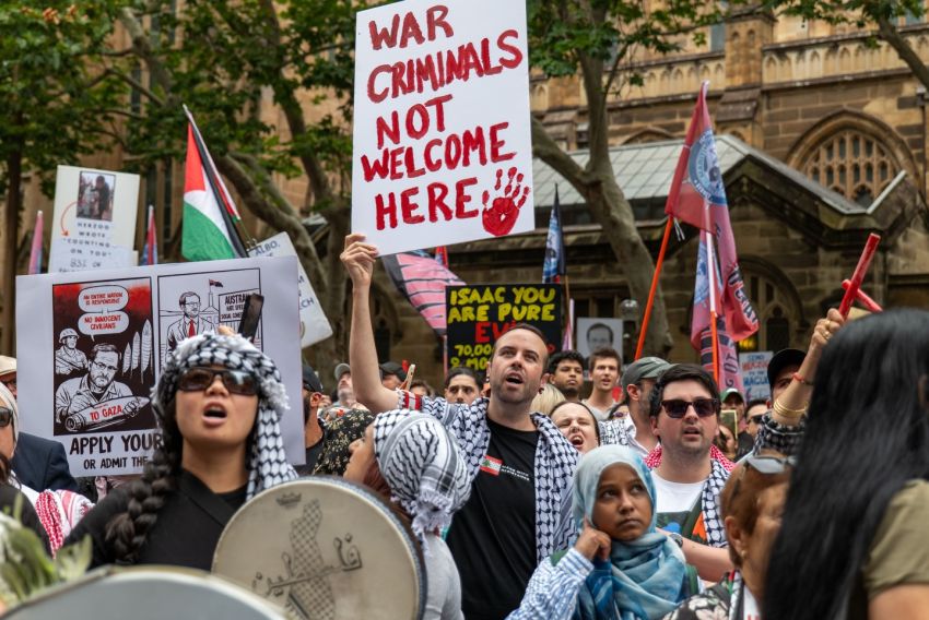 war criminals not welcome here poster at protest against Israeli president isaac Herzog at Sydney Town Hall on february 9