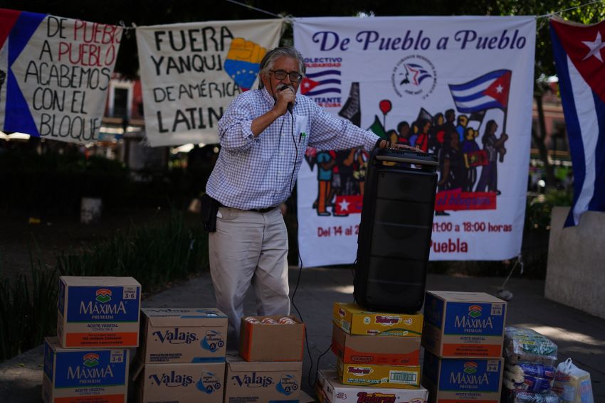 Person standing at an aid collection point in Puebla