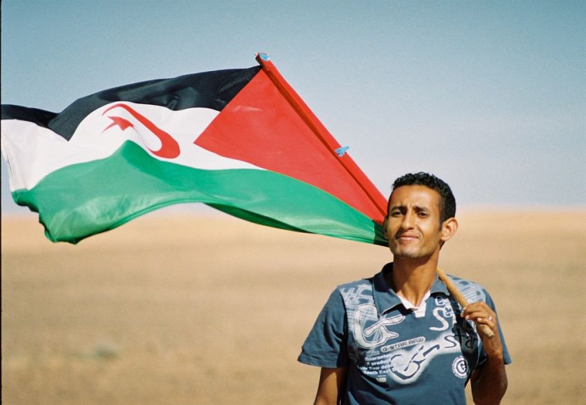 Man holding Western Sahara flag