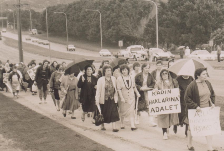 women marching with banners and signs