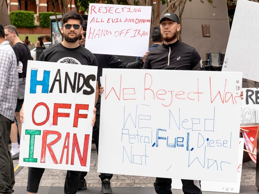 people holding signs