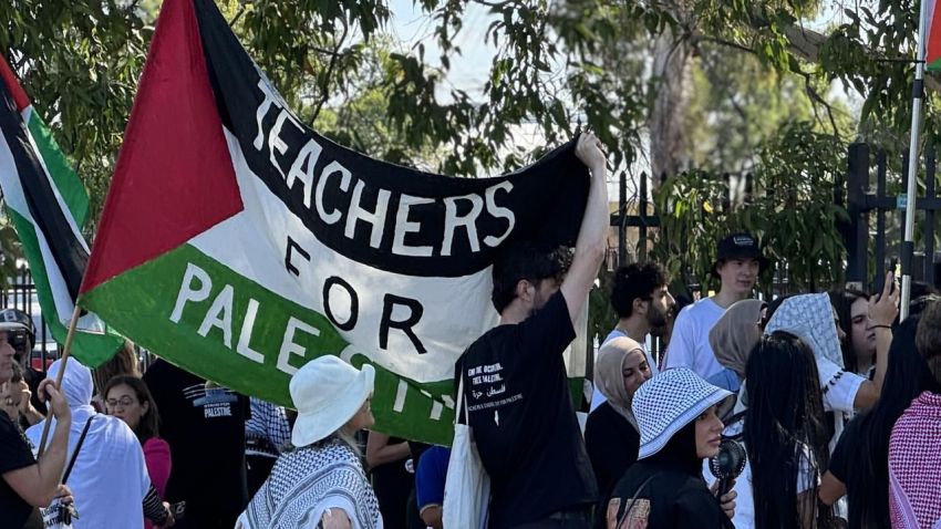Protestors with Teachers for Plaestine banner.
