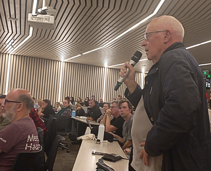 person speaking with microphone
