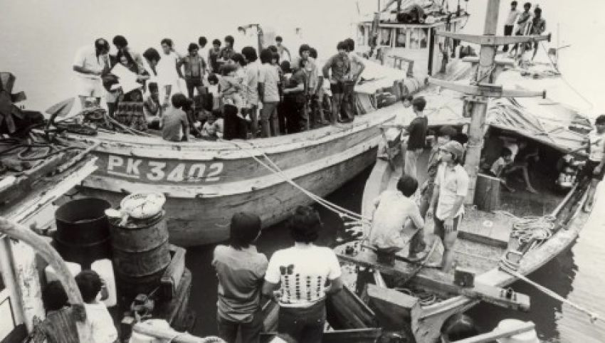 Black and white photograph of refugees on boats, unknown photographer, location and date.