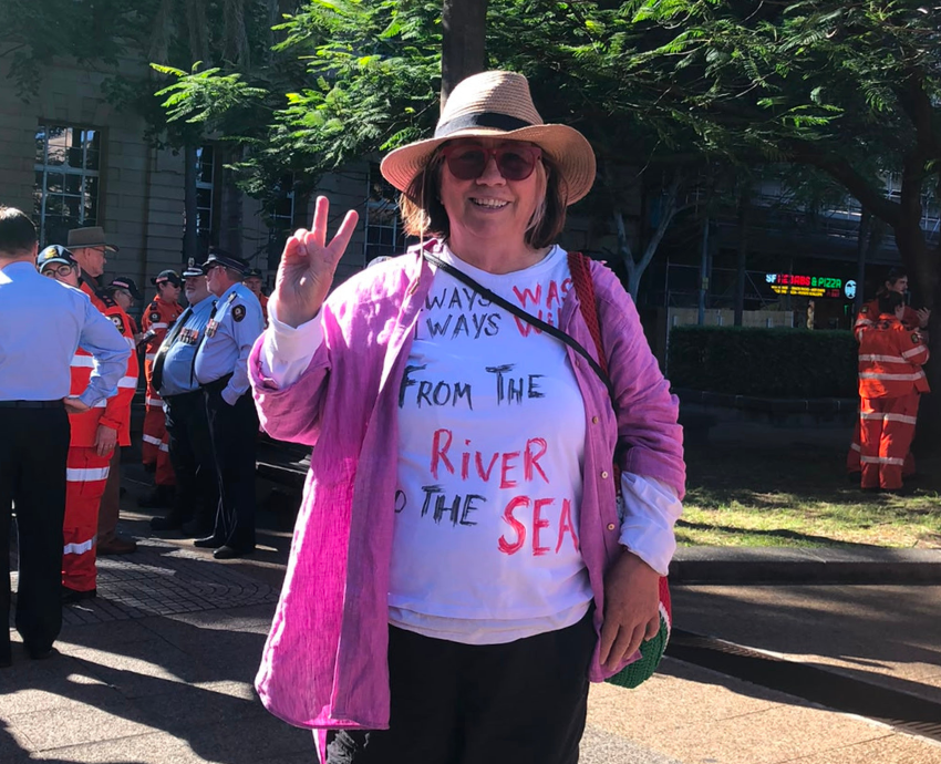 Woman holding up a peace sign