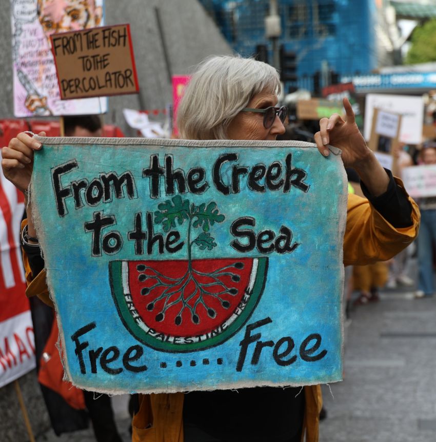 People brought creative signs to defy the anti-free speech laws