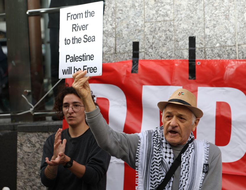 Stephen Heydt carrying "from the River to the Sea" sign