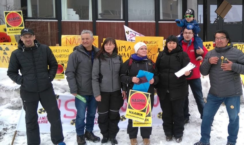 group of people holding signs