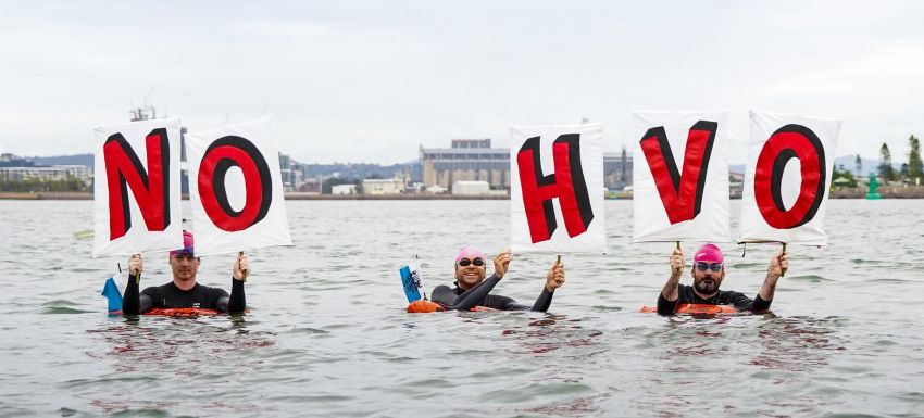 Rising Tide activists holiding No HVO letter signs