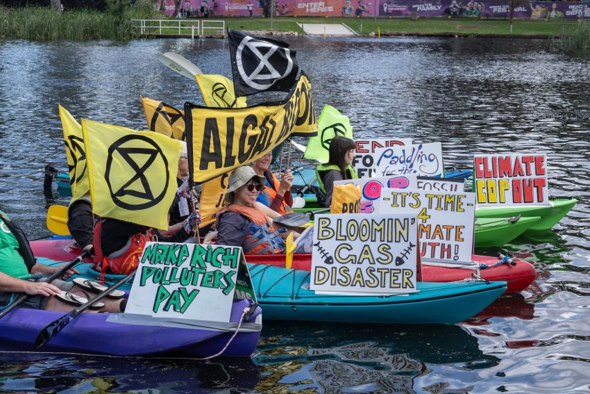 Activists in kayaks at a Extinction Rebellion South Australian action in Tarntanya