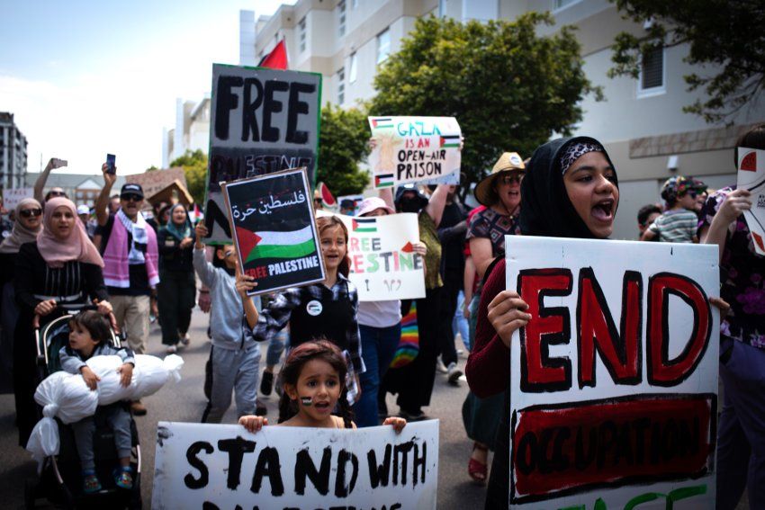 protesters holding signs