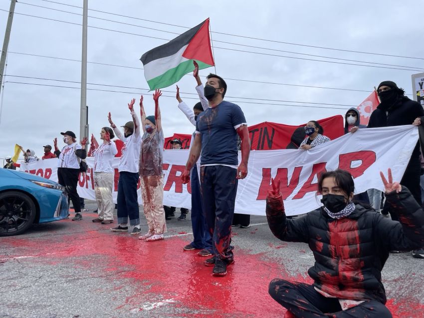 protesters outside an arms fair