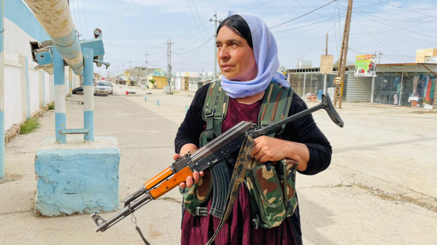 woman patrolling with a gun
