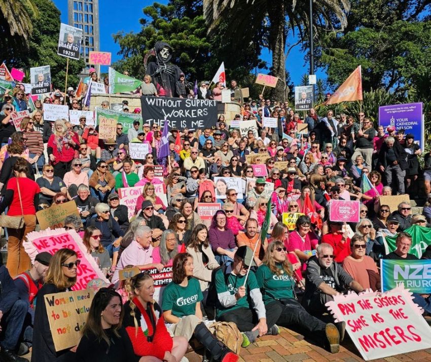 group of people with flags and signs