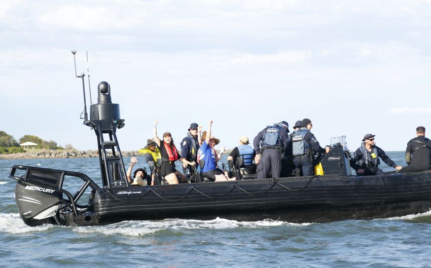 Arrestees defiant on police boat Arrestees defiant on police boat