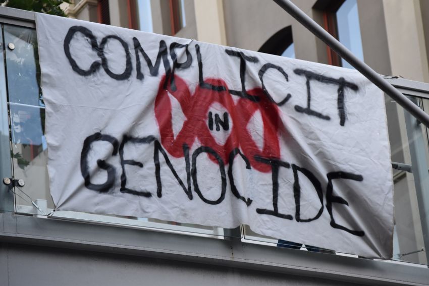 banner outside ABC says complicit in genocide