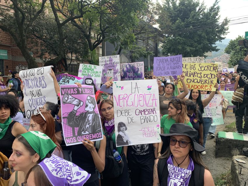 women marching with signs