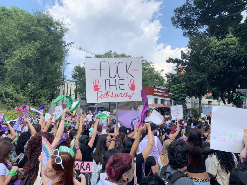 women marching with signs