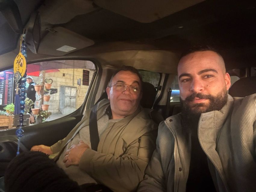 Two men in the back of a car