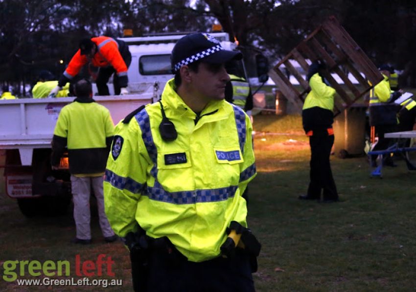 Police guard council workers during Matagarup Aboriginal encampment raid June 18, 2015.