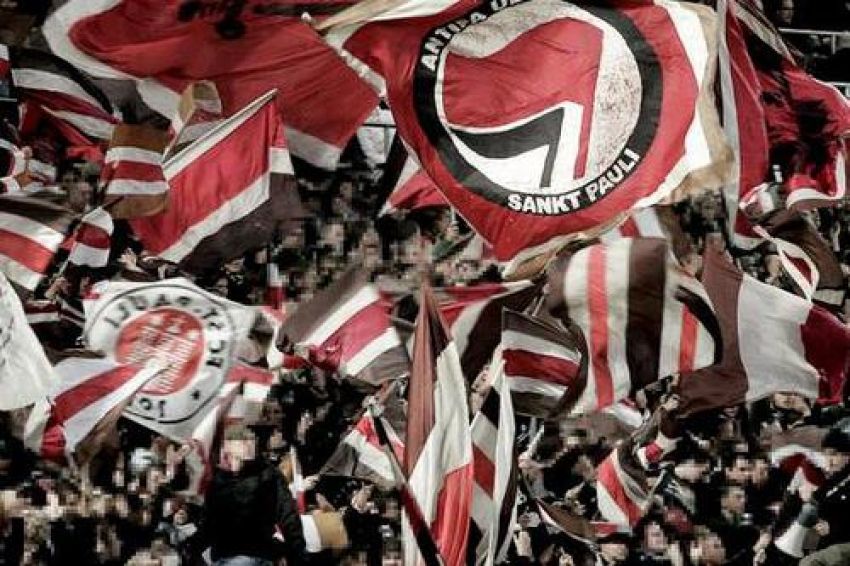 Anti-fascist flag flies among FC St Pauli fans.